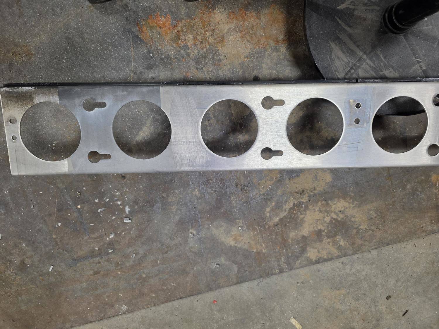 Industrial metal plate before and after laser cleaning